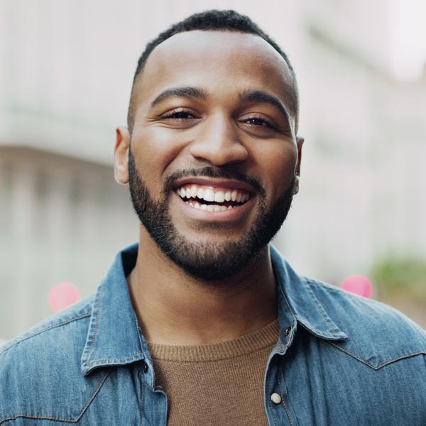 Portrait of a handsome young man in the city