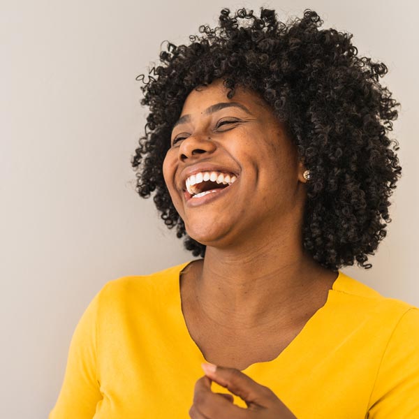 Portrait of a young woman laughing.