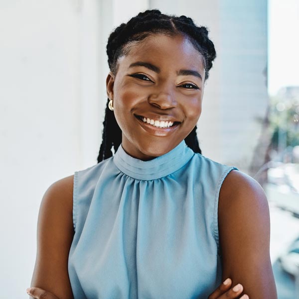 Confident young black businesswoman smiling in an office
