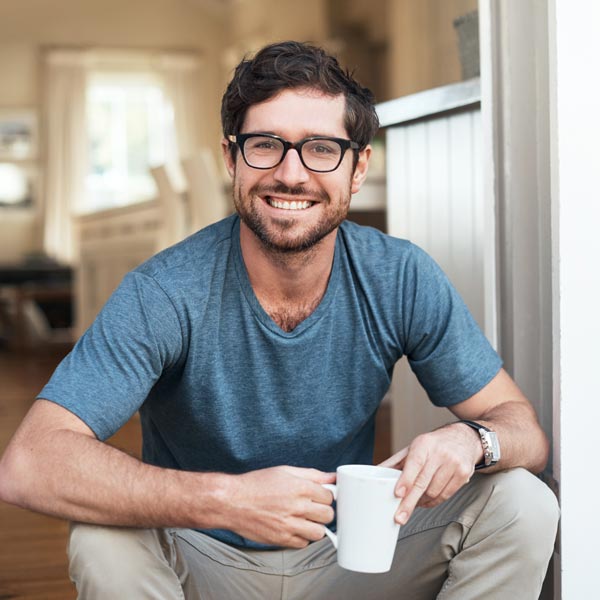 Cropped portrait of a handsome young man enjoying a cup of coffee in the morning